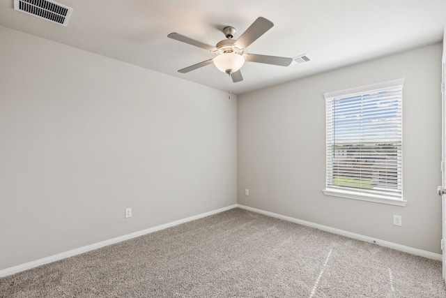 carpeted empty room featuring ceiling fan