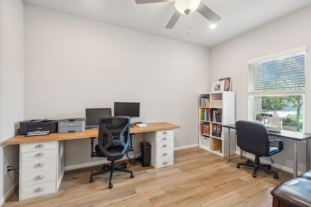 office with ceiling fan and light hardwood / wood-style floors