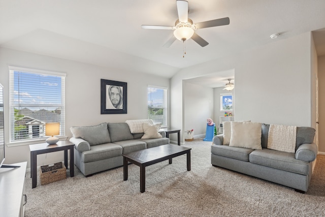 living room featuring ceiling fan, light colored carpet, and lofted ceiling