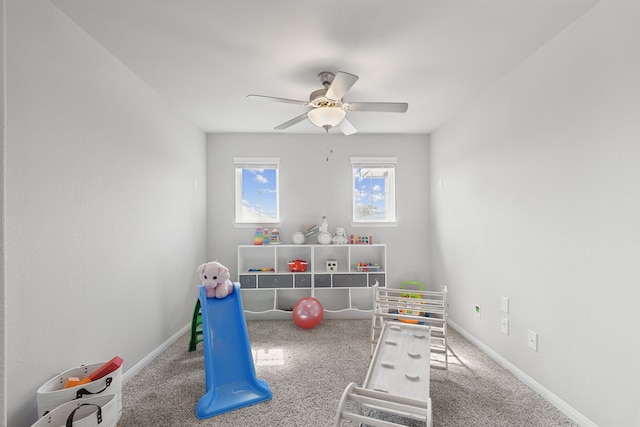 playroom with carpet flooring and ceiling fan