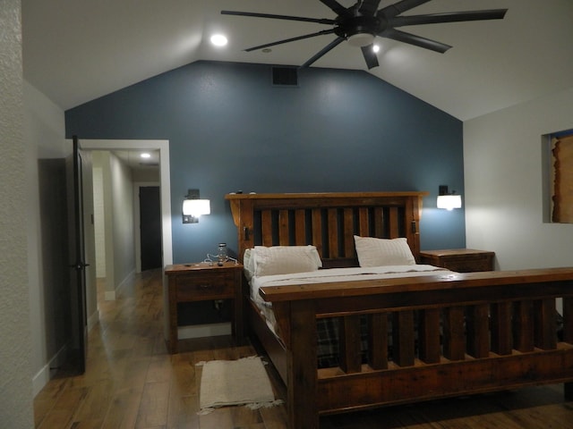 bedroom featuring lofted ceiling, wood-type flooring, visible vents, and ceiling fan