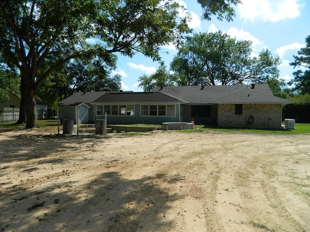 single story home featuring cooling unit