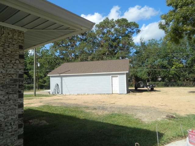 garage featuring a storage shed