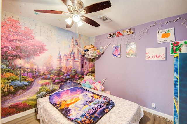 bedroom featuring hardwood / wood-style flooring and ceiling fan