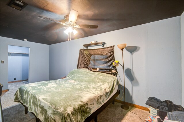 bedroom featuring ceiling fan and light carpet