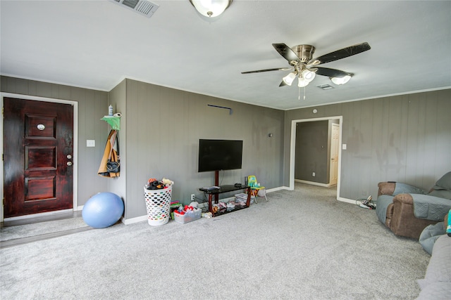 living room featuring light colored carpet and ceiling fan