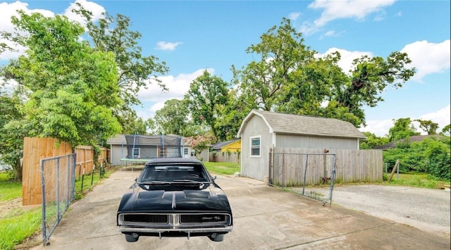 view of car parking featuring a trampoline