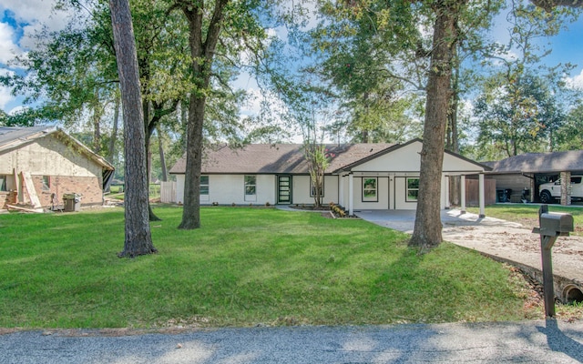 single story home featuring a front lawn and a carport