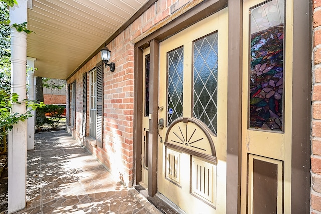 doorway to property featuring a porch