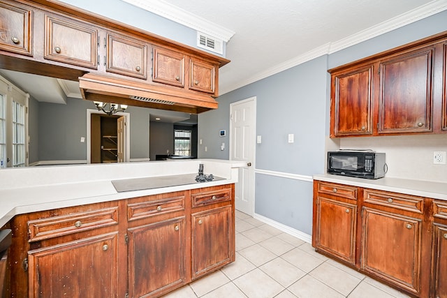 kitchen featuring crown molding and light tile patterned flooring