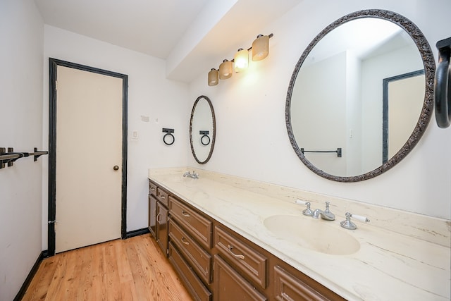 bathroom with vanity and wood-type flooring