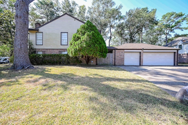 view of front of house with a front lawn and a garage