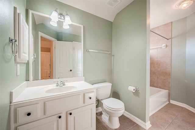 full bathroom featuring tile patterned floors, vanity, toilet, and tiled shower / bath