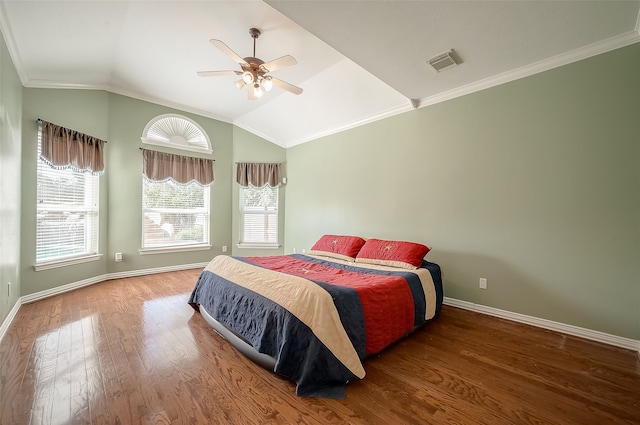 bedroom with hardwood / wood-style flooring, ceiling fan, lofted ceiling, and ornamental molding