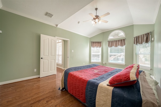 bedroom featuring ceiling fan, crown molding, lofted ceiling, and hardwood / wood-style flooring