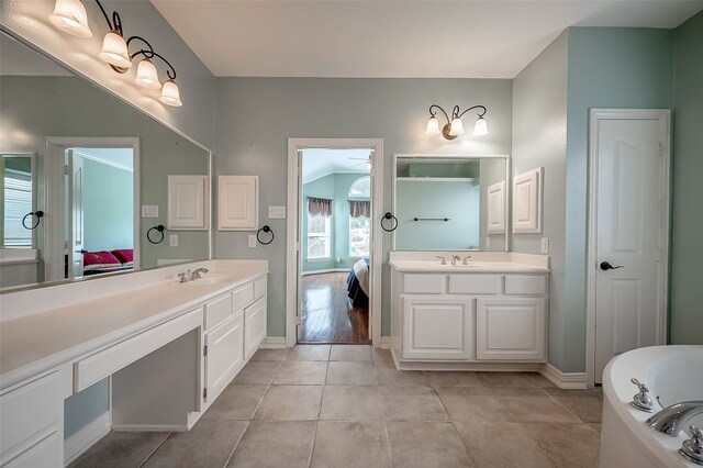 20807 Twisted Leaf Dr, Cypress, TX 77433 - full bathroom with connected bathroom, two vanities, baseboards, and a tub