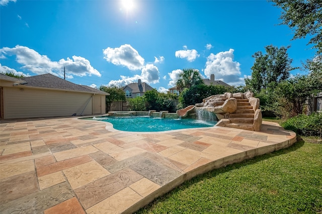 view of pool featuring pool water feature and a patio area