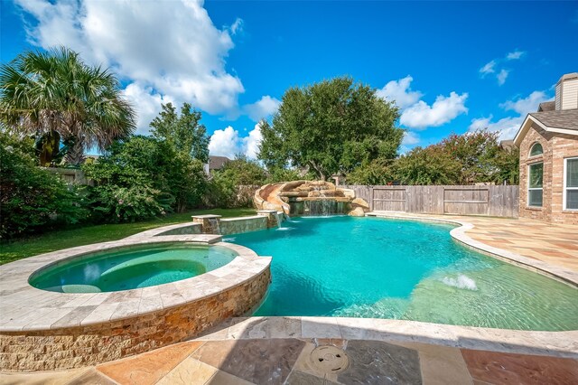 20807 Twisted Leaf Dr, Cypress, TX 77433 - view of swimming pool with a pool with connected hot tub, a fenced backyard, and a patio
