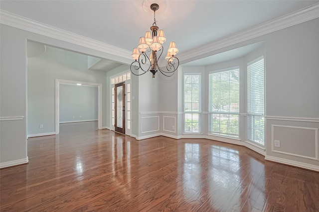 20807 Twisted Leaf Dr, Cypress, TX 77433 - unfurnished room featuring a chandelier, crown molding, a decorative wall, wainscoting, and wood finished floors