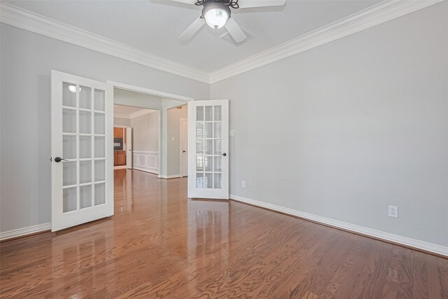 20807 Twisted Leaf Dr, Cypress, TX 77433 - empty room featuring crown molding, french doors, a ceiling fan, wood finished floors, and baseboards