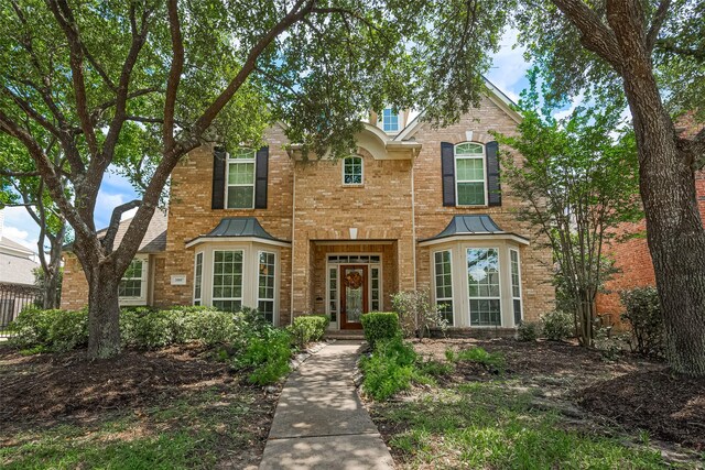 20807 Twisted Leaf Dr, Cypress, TX 77433 - traditional-style home with a standing seam roof, brick siding, and metal roof