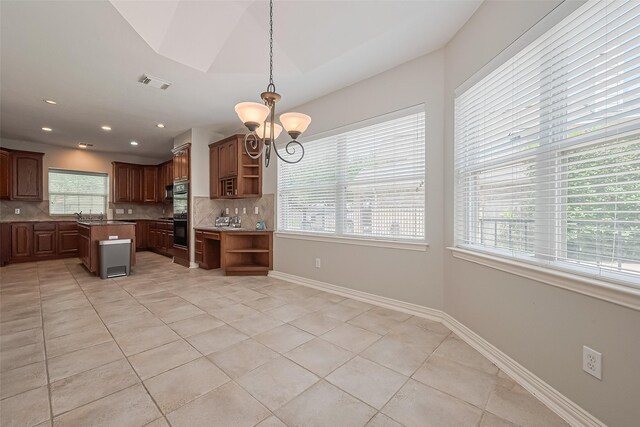 20807 Twisted Leaf Dr, Cypress, TX 77433 - kitchen with open shelves, backsplash, light tile patterned floors, a kitchen island, and recessed lighting