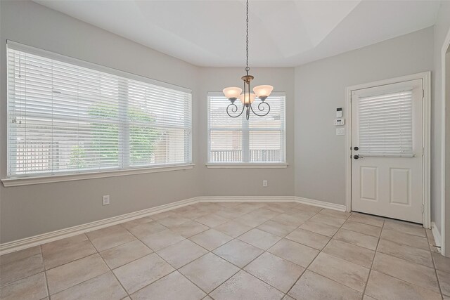 20807 Twisted Leaf Dr, Cypress, TX 77433 - unfurnished dining area featuring a chandelier, light tile patterned floors, and baseboards