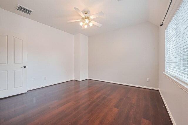 20807 Twisted Leaf Dr, Cypress, TX 77433 - spare room featuring dark wood-type flooring, ceiling fan, baseboards, and vaulted ceiling
