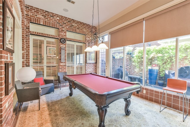 playroom featuring brick wall, plenty of natural light, and billiards