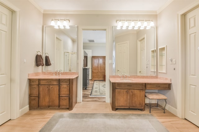 bathroom featuring wood-type flooring, vanity, and crown molding