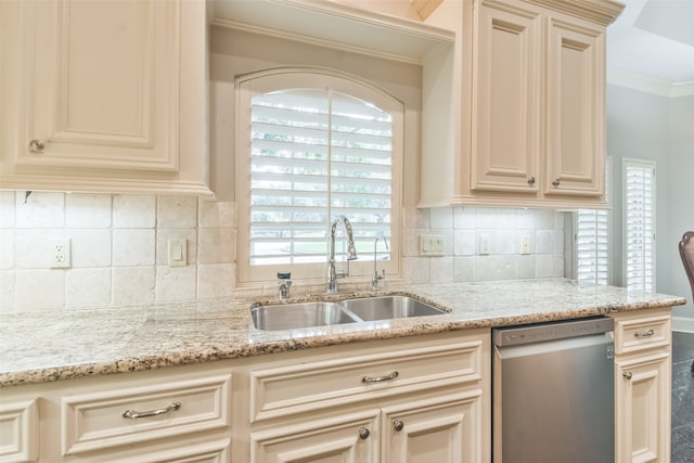 kitchen featuring cream cabinetry, tasteful backsplash, dishwasher, crown molding, and sink