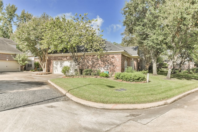 view of front of property with a garage and a front yard