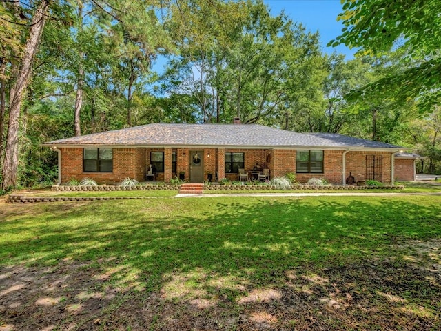 single story home featuring a front yard