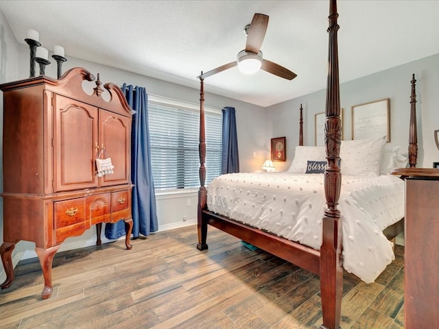 bedroom featuring ceiling fan and hardwood / wood-style floors