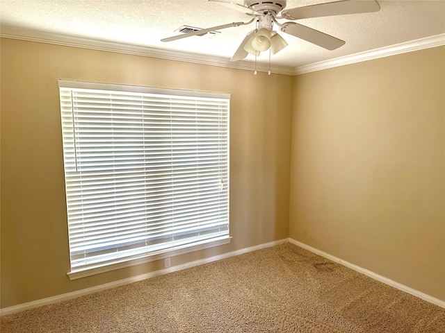 carpeted spare room with ornamental molding, ceiling fan, and a textured ceiling