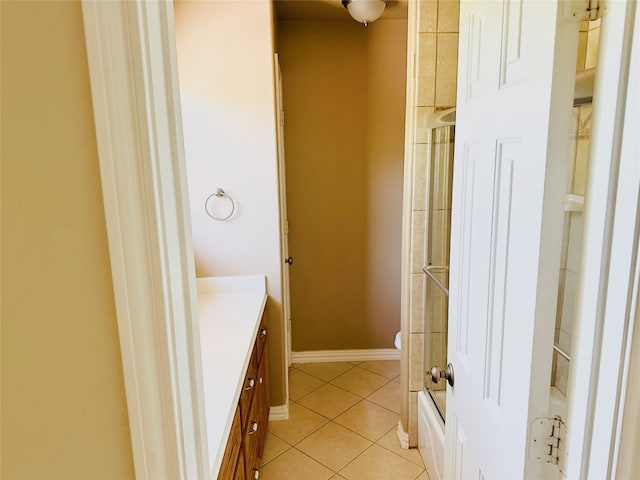 bathroom featuring tile patterned flooring, vanity, and toilet