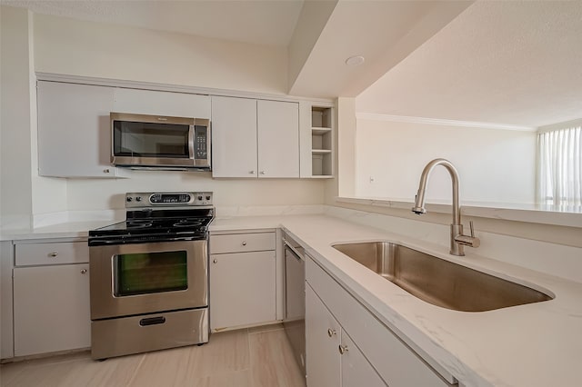 kitchen featuring white cabinetry, appliances with stainless steel finishes, and sink