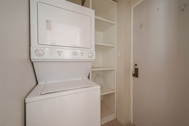 washroom with stacked washer / dryer