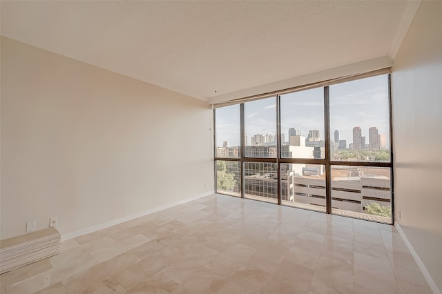 empty room featuring floor to ceiling windows