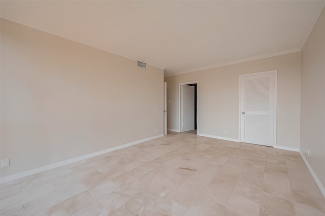 empty room featuring ornamental molding