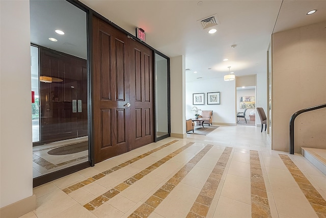 interior space with light tile patterned floors