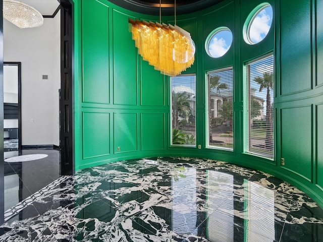 bedroom featuring a notable chandelier