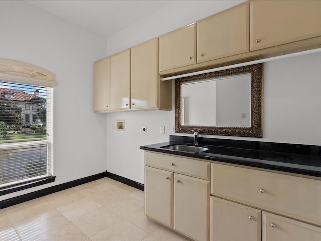 kitchen featuring cream cabinets and sink