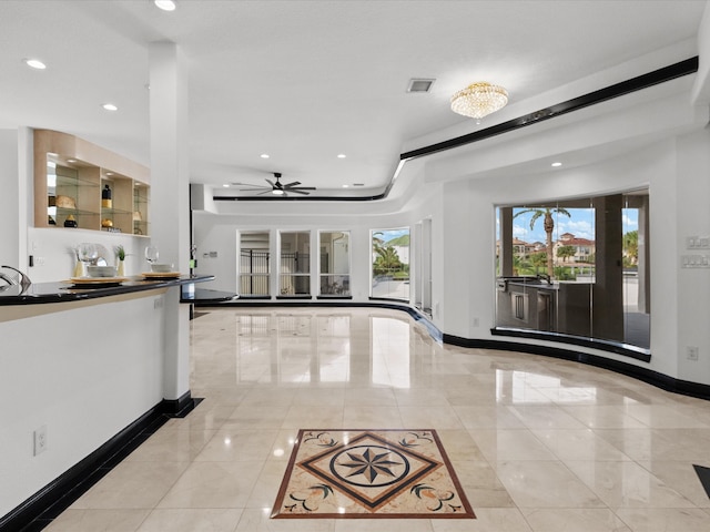 entryway with ceiling fan and french doors