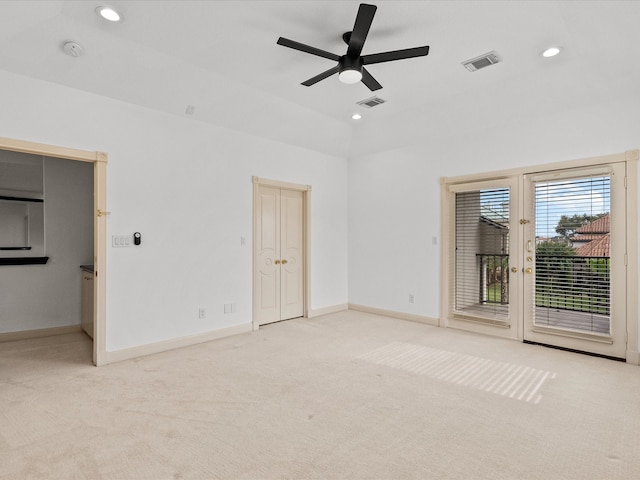 unfurnished bedroom featuring access to outside, ceiling fan, and light carpet