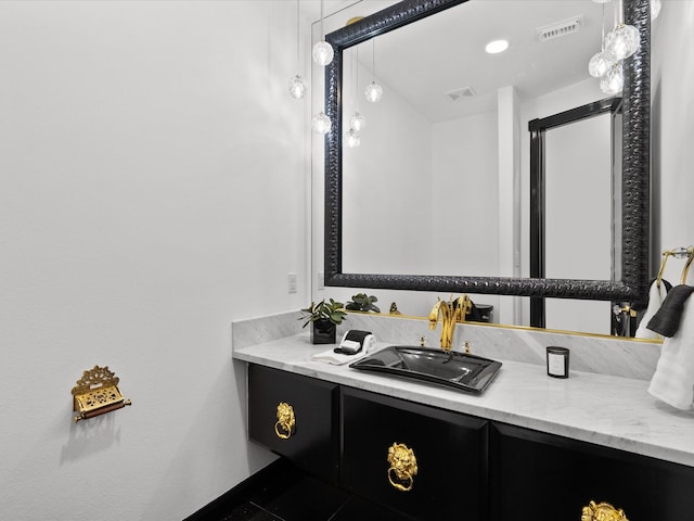 bathroom with vanity and tile patterned floors