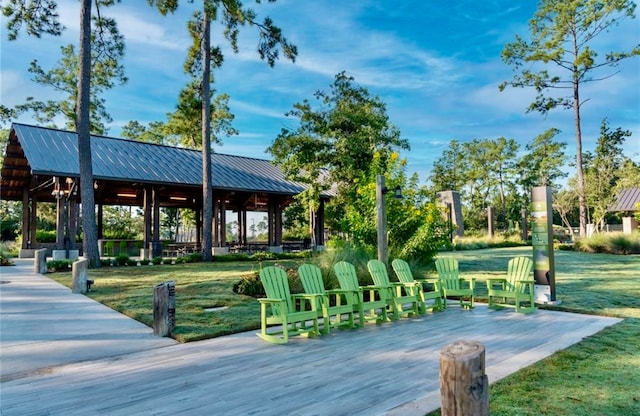 view of property's community with a gazebo and a lawn