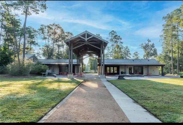 11915 Parsifal Creek Rd, Humble, TX 77346 - exterior space featuring metal roof and a front yard