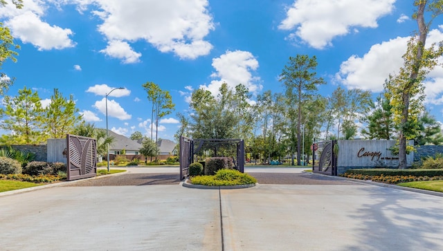 11915 Parsifal Creek Rd, Humble, TX 77346 - view of street featuring a gated entry, curbs, and street lighting