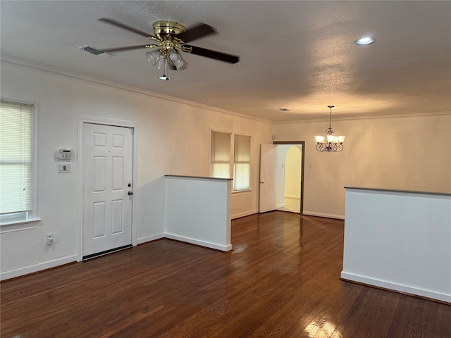 unfurnished room with ceiling fan with notable chandelier, dark hardwood / wood-style floors, and ornamental molding